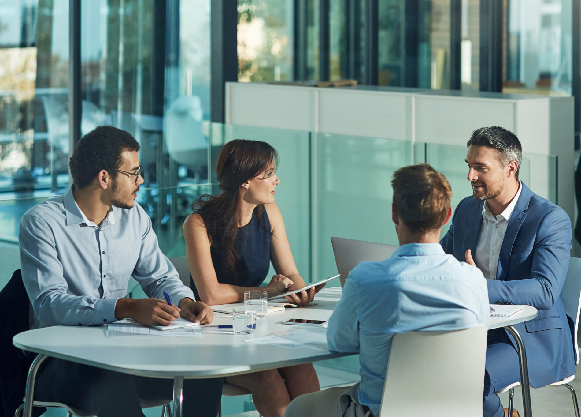 leadership group sits around table together - Leadership Development CEO Executive Coaching - Nationwide, Washington DC, Charleston SC - Peter D Schwartz Vistage