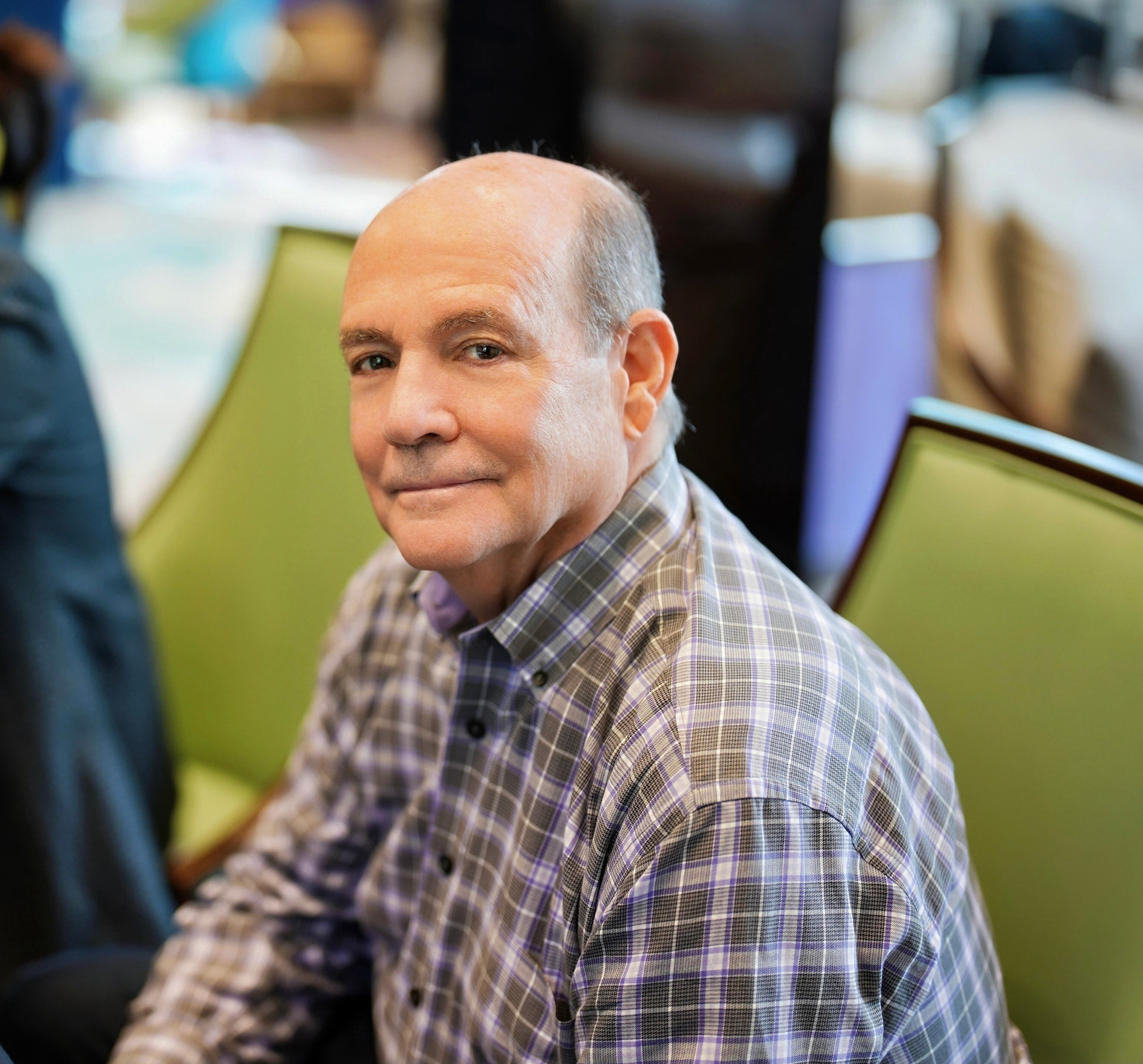 Peter D Schwartz Portrait Photo CEO Coach Vistage Executive Coaching sitting at chair