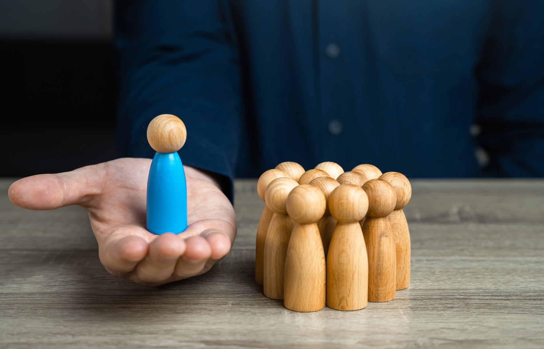 Hand holding wooden person - Certified LCP 360 Leadership Circle Profile Assessment Coach Peter D Schwartz DC South Carolina